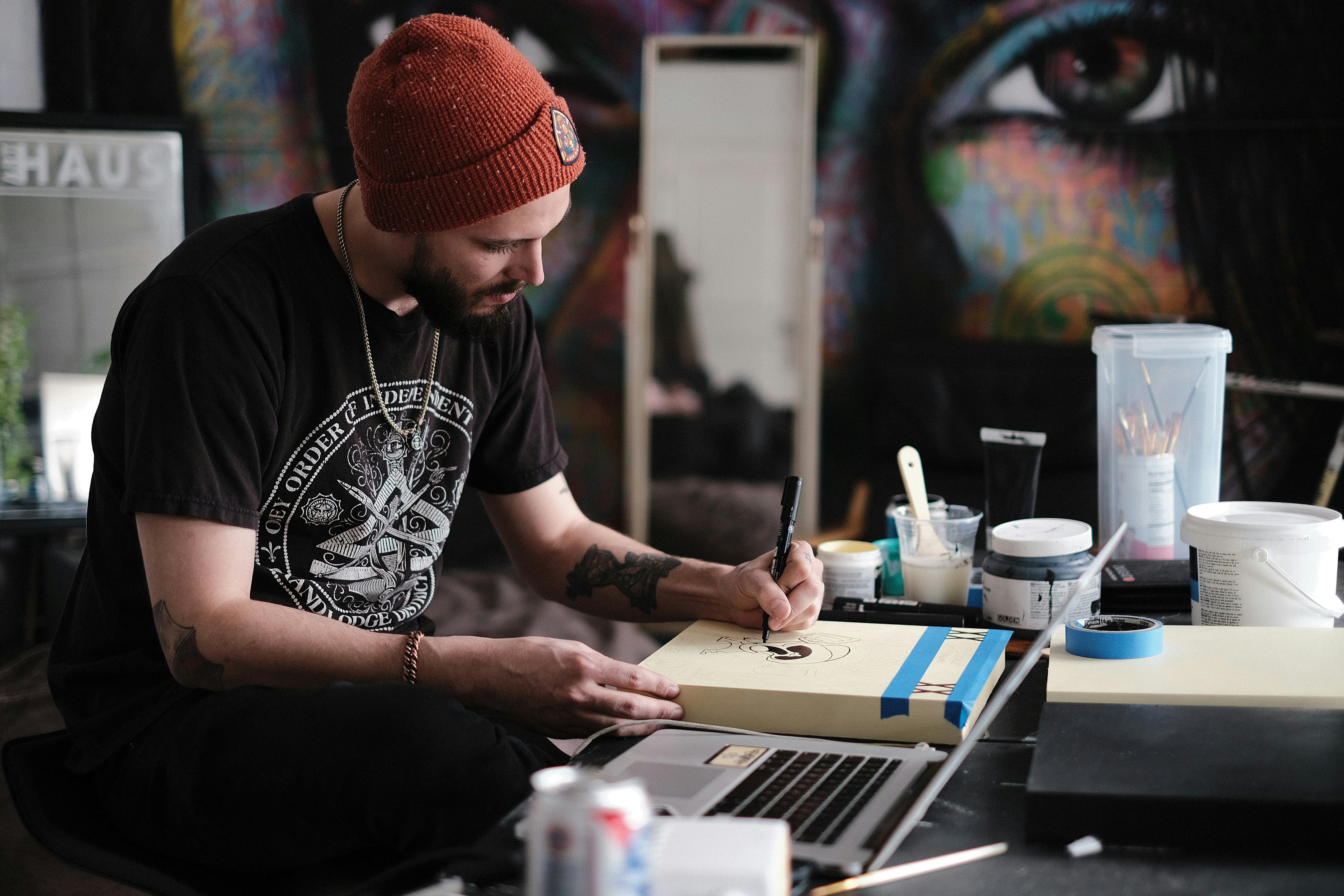 A person works in a studio full of different items.